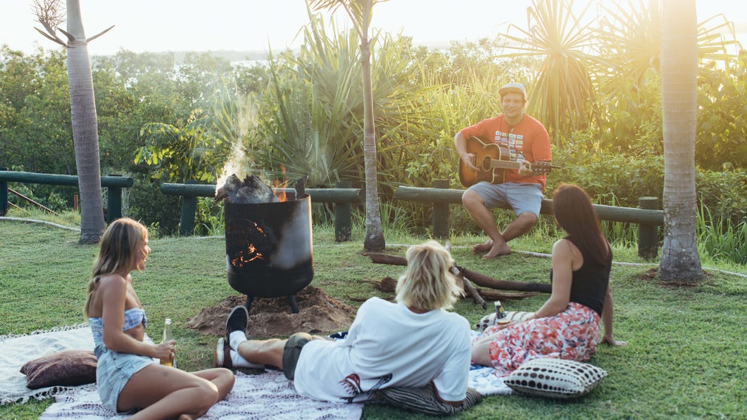 Friends listening to musician at the Tiwi Islands Clearwater Island Lodge