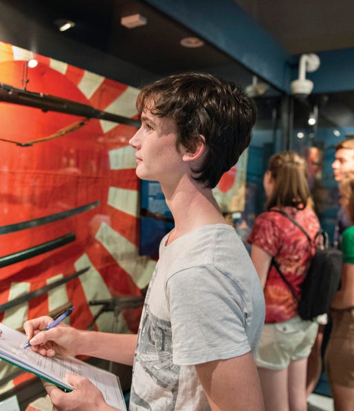 Boy looking at artillery at the Darwin Military Museum in Darwin