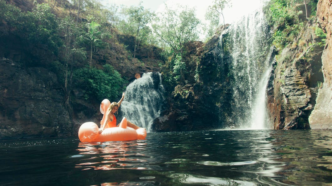 Woman floating at Florence Falls Litchfield National Park